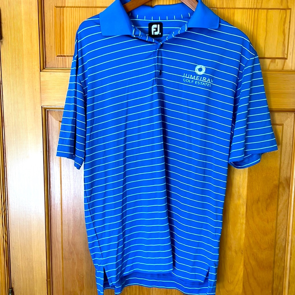 Footjoy medium blue golf polo with golf estates logo. Size fits medium-large.